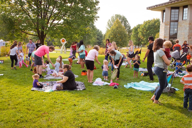 Families and children dancing to music